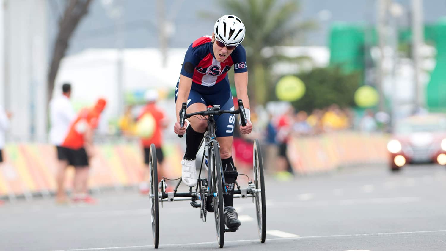 Jill Walsh competes on her tricycle at the Paralympic Games Rio 2016. She is wearing a red, white and blue Team USA uniform