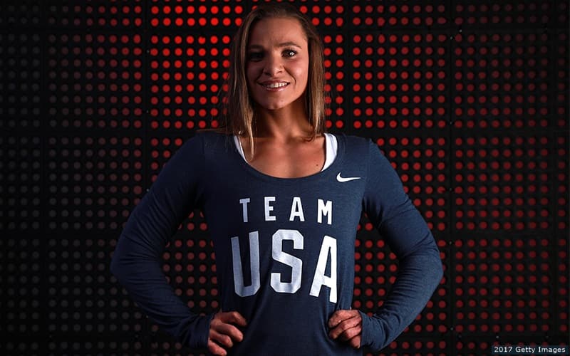 Oksana Masters pictured in front of a red backdrop at the 2017 Team USA Media Summit in Park City, Utah.