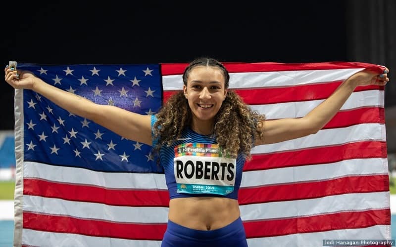 Jaleen Roberts holds the American flag after her event at the world championships in Dubai