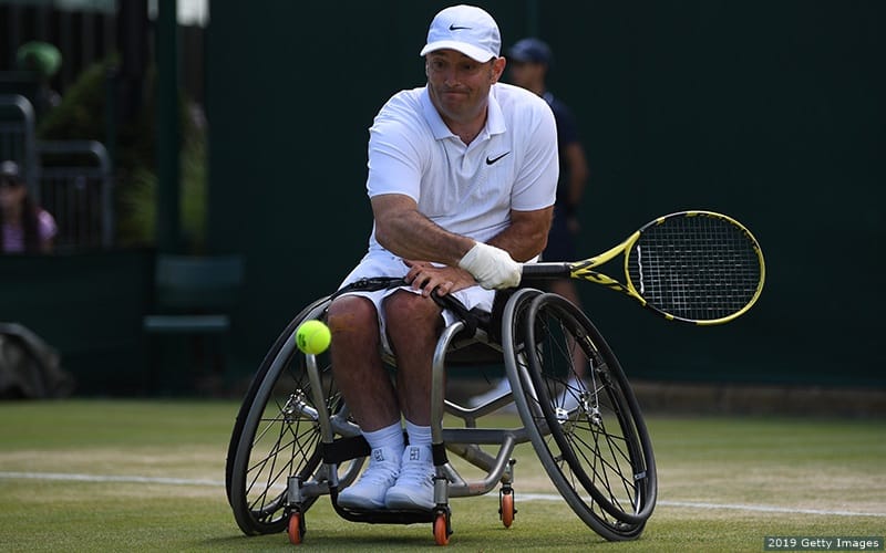 David Wagner returns a serve in wheelchair tennis at the Wimbledon championships in London, England.
