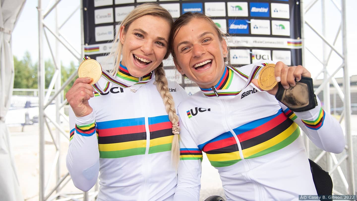 Masters and Brim smile for camera with medals. 