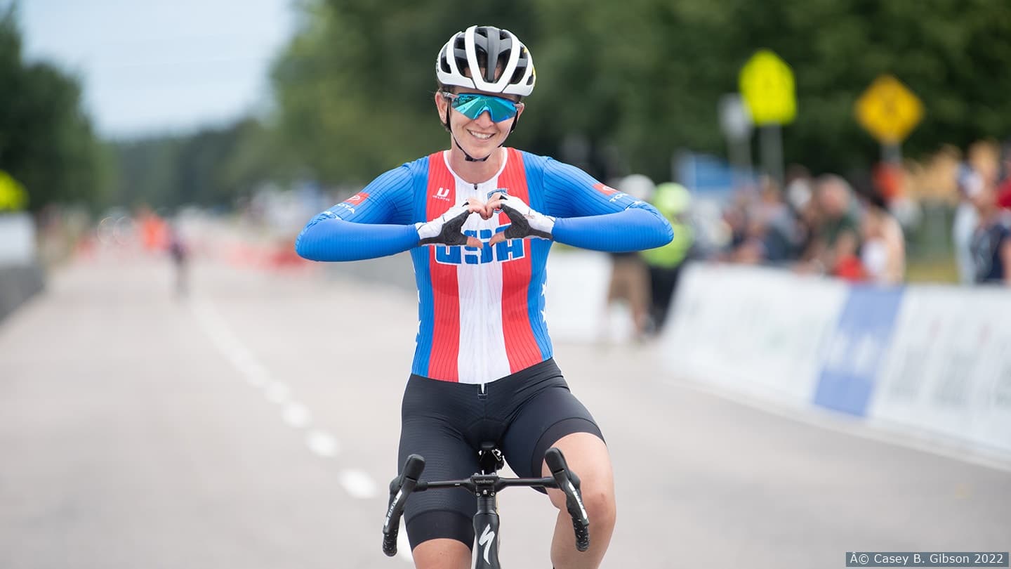 Sam Bosco finishes road race creating heart of out of hands. 