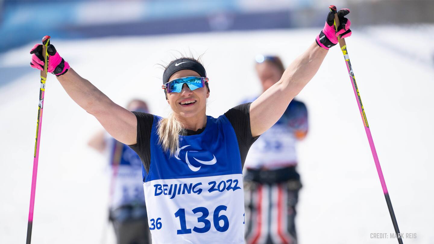 Oksana Masters crosses the finish line after an event at the 2022 Winter Paralympics