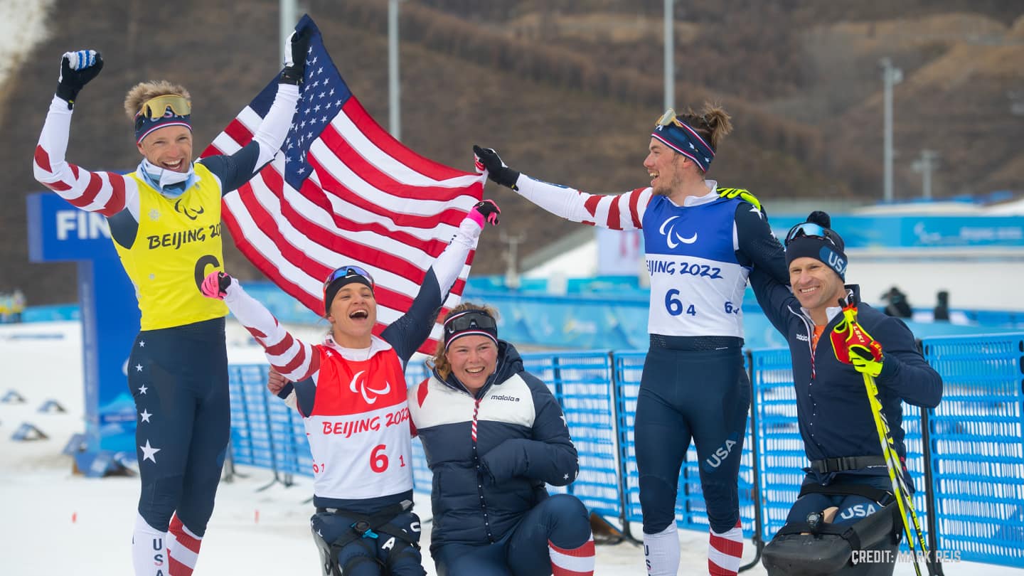 Team USA celebrate after winning gold in the cross-country mixed relay