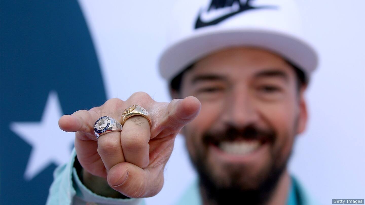 Keith Gabel smiles with hand out. 