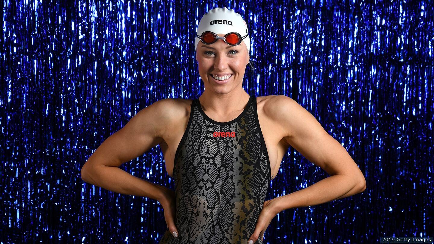 Jessica Long poses for camera smiling. 