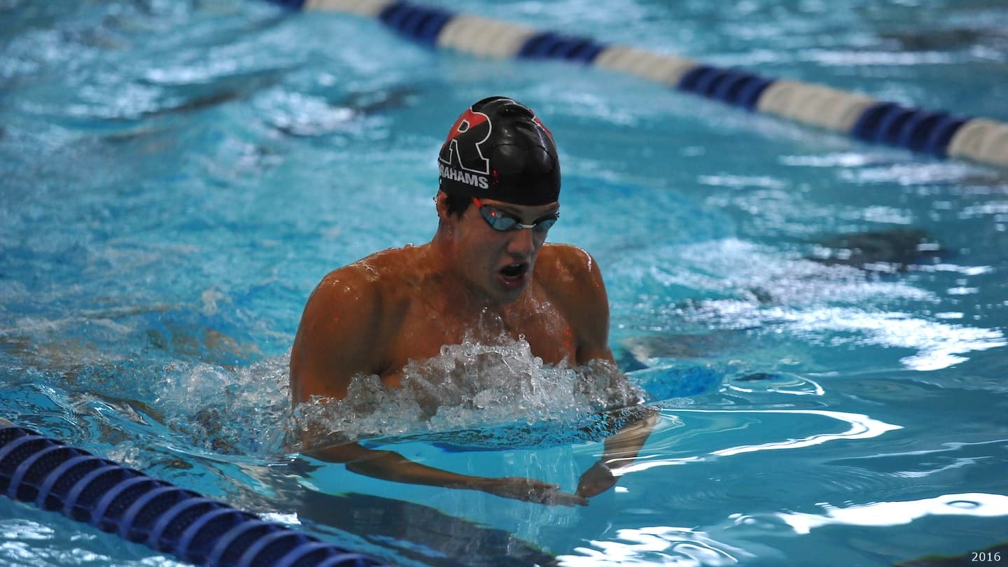 Swimmer competes in meet. 