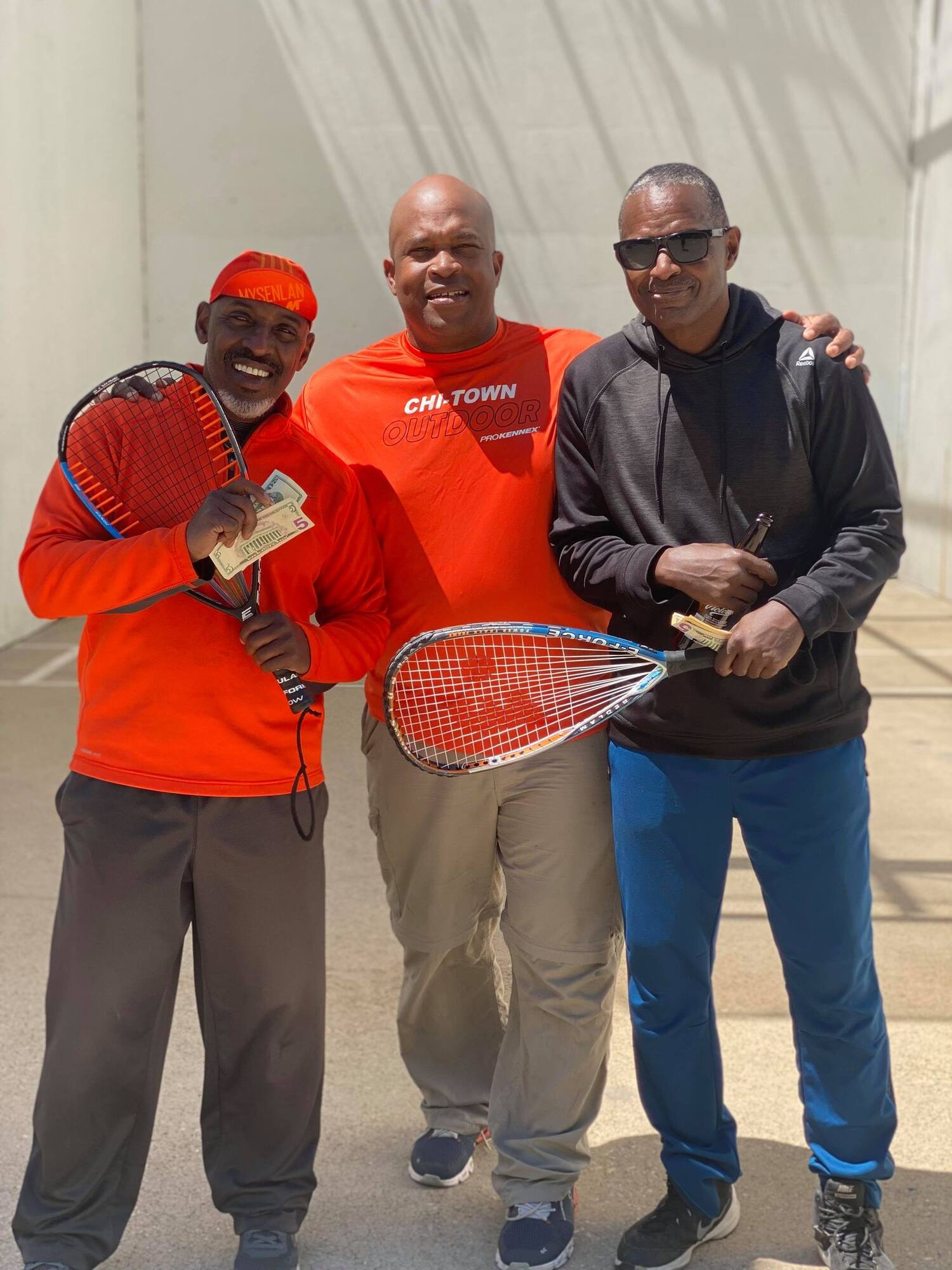 Tournament Director Joey Logan handing out prize money