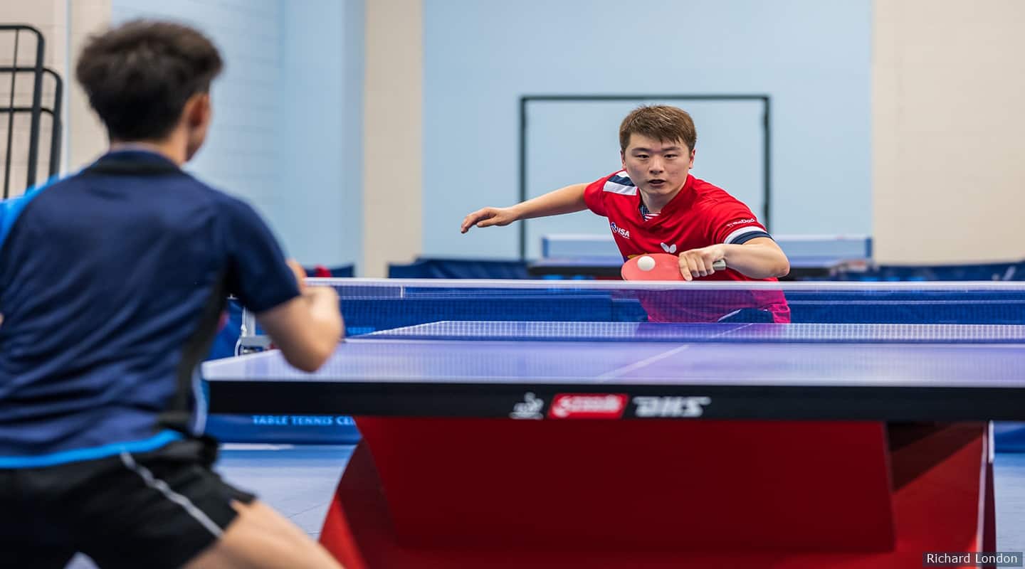 [Photo: Jishan Liang facing Kai Zhang]