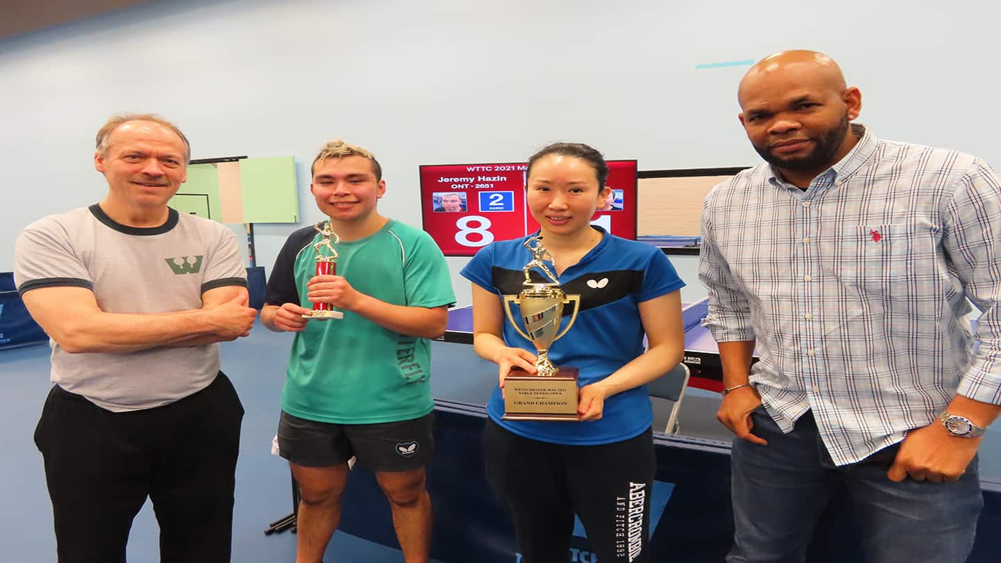 [Photo:]  Left to right: Will Shortz, Jeremy Hazin, Juan Liu, Robert Roberts