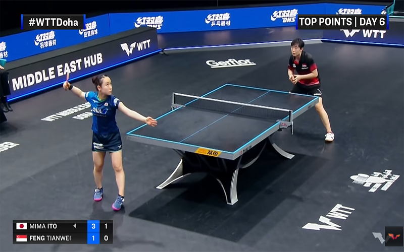 Mima Ito serving to Feng Tianwei at WTT 2021 Doha Star Contender
