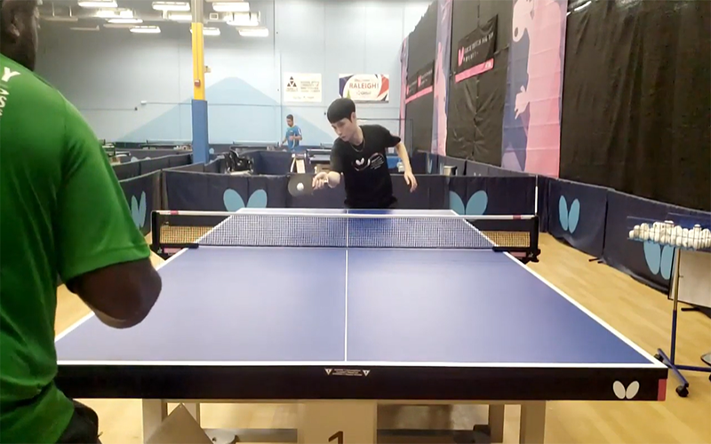 Yu Di returning a ball in training.