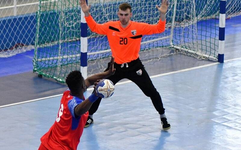 Cuba's Reiner Taboada gets ready to fire on USA Goalkeeper Hendrik Schultze