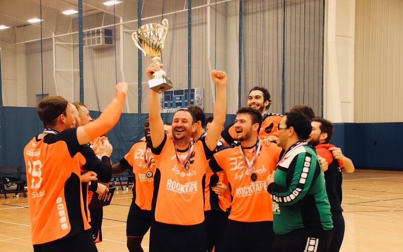 Cal Heat players celebrate with their trophy.