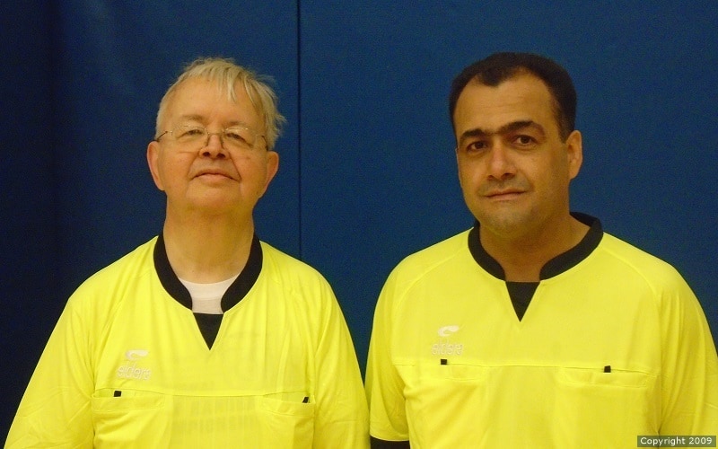 Officials Christer Ahl and Majid Kolahdouzan pose together after a game.