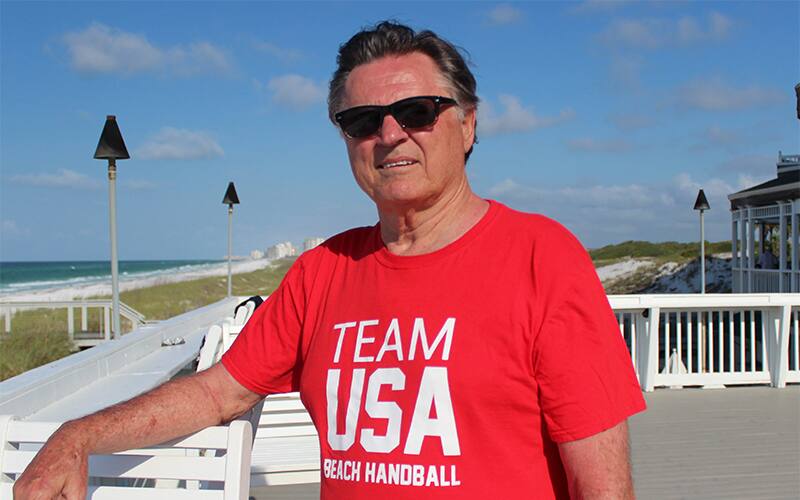 1972 Olympian Dennis Berkholtz poses by the beach.