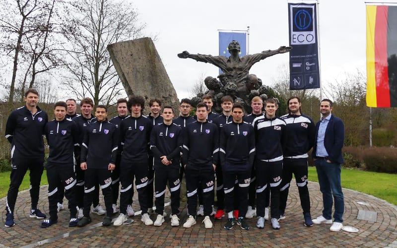 The 2019 U.S. Junior Men's National Team pose for a team photo in Germany.