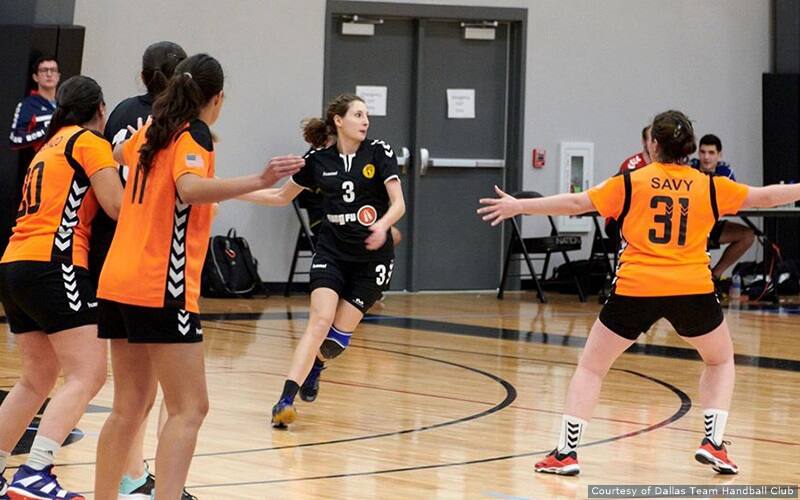 An athlete prepares to pass the ball at the Texas Cup.