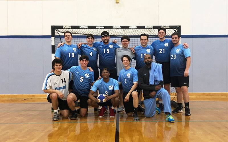 Carolina Men's Handball Team athletes posing for a group photo
