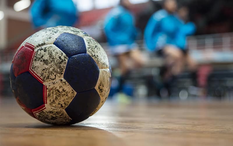 Photo of a handball on a court.