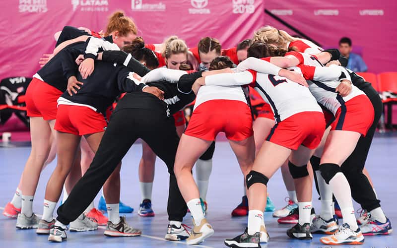 Women's National Team members in a huddle during the 2019 Pan American Games in Lima, Peru