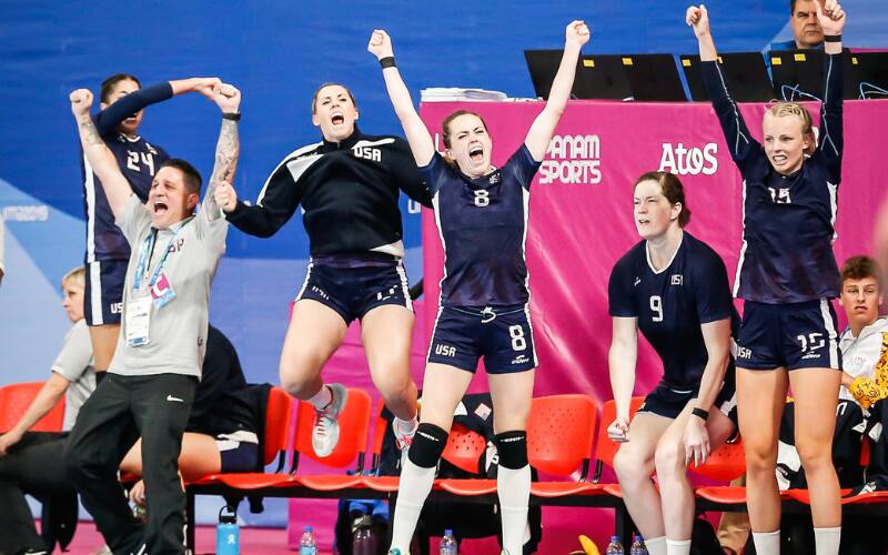 Julio Sainz and members of the Women's National Team cheering at the 2019 Pan American Games