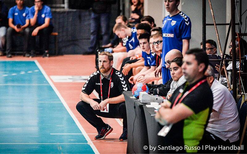 A photo of Craig Rot coaching team handball. 