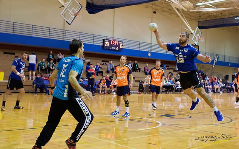 A handball player taking a shot during a match at the 10th annual Michael Lipov Memorial tournament in Chicago, Illinois in the fall of 2019. 