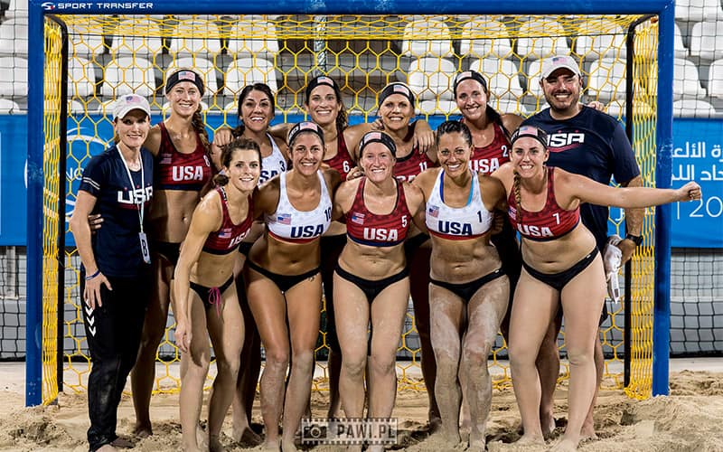 A team photo of the U.S. women's national beach handball team at the 2019 ANOC World Beach Games in Doha, Qatar.