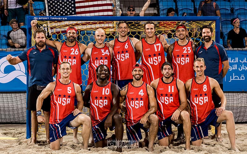A team photo of the U.S. men's national beach handball team at the 2019 ANOC World Beach Games in Doha, Qatar.