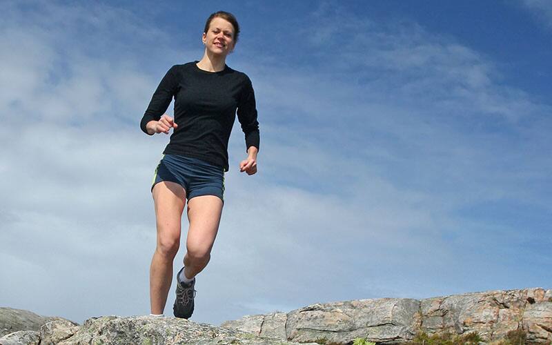 woman running on rocks