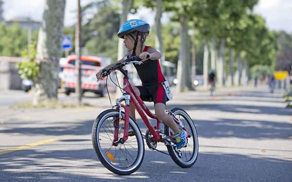 youth triathlete on bike