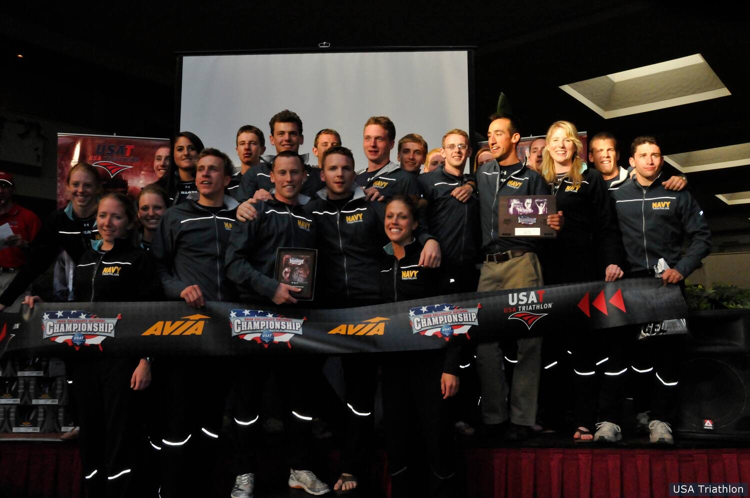 The U.S. Naval Academy celebrates their 2009 title at the post-race award ceremony.