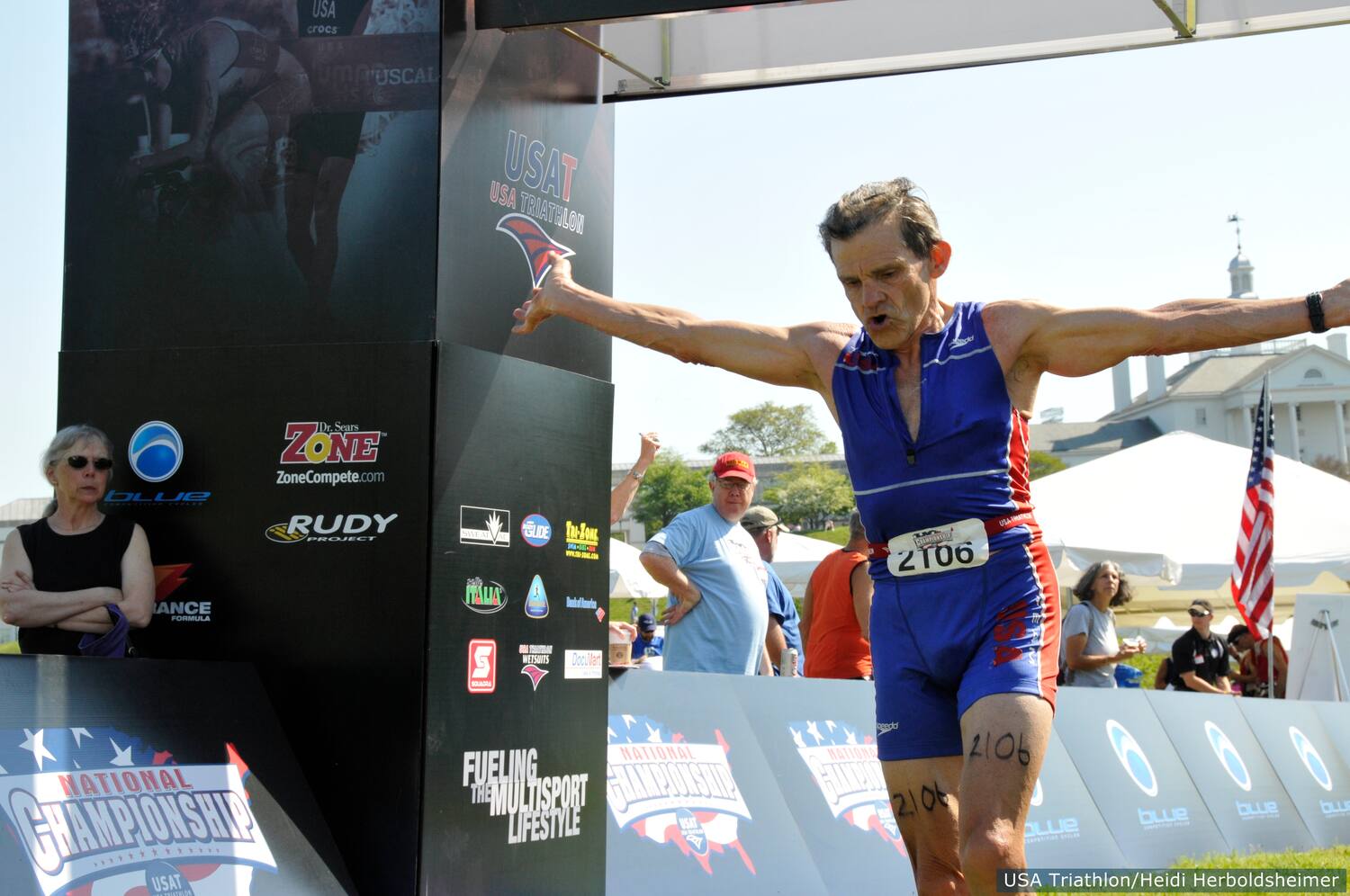 Roger Brockenbrough crosses the finish line and wins the M75-79 age group.