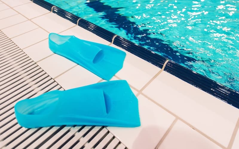fins beside swimming pool