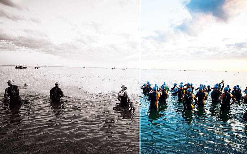 photo illustration of triathletes in the water at starting line of a race