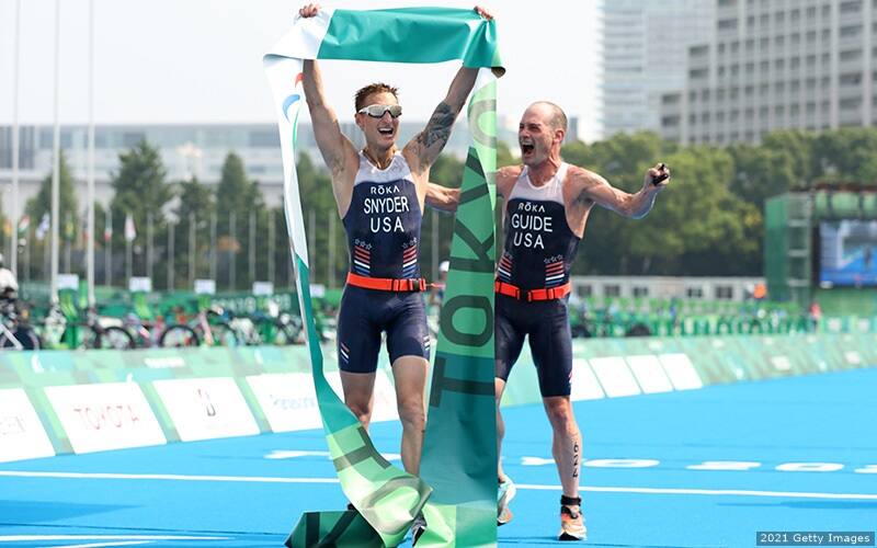 brad snyder and greg billington cross the finish line after winning the paralympic gold medal in paratriathlon