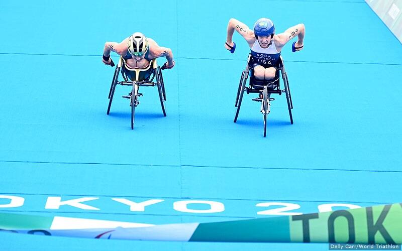 Kendall Gretsch sprints toward the finish line to win the women's PTWC paratriathlon gold medal at the Paralympic Games Tokyo 2020.