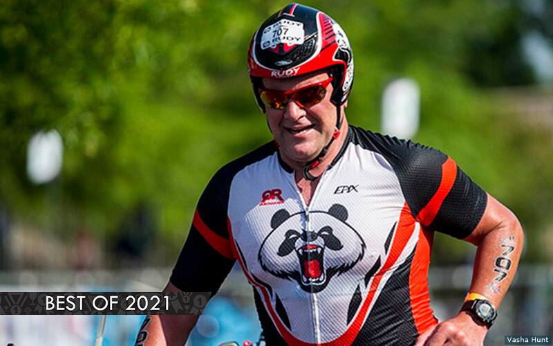 man running with his bike in a duathlon race