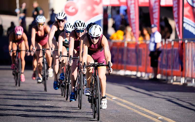 women's varsity collegiate triathletes in a bike pack at national championships in tempe