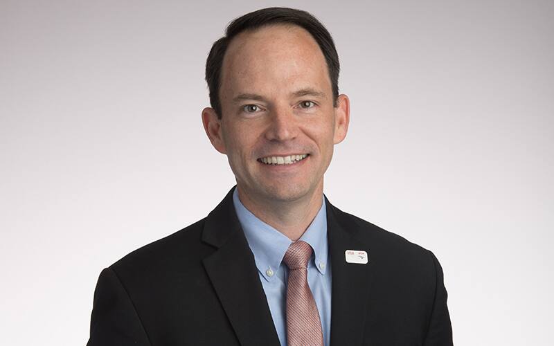 rocky harris poses for a headshot