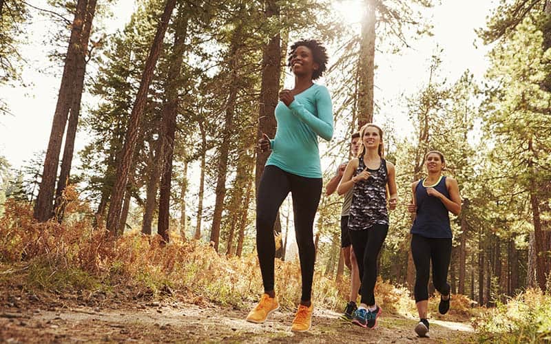Women running in the woods