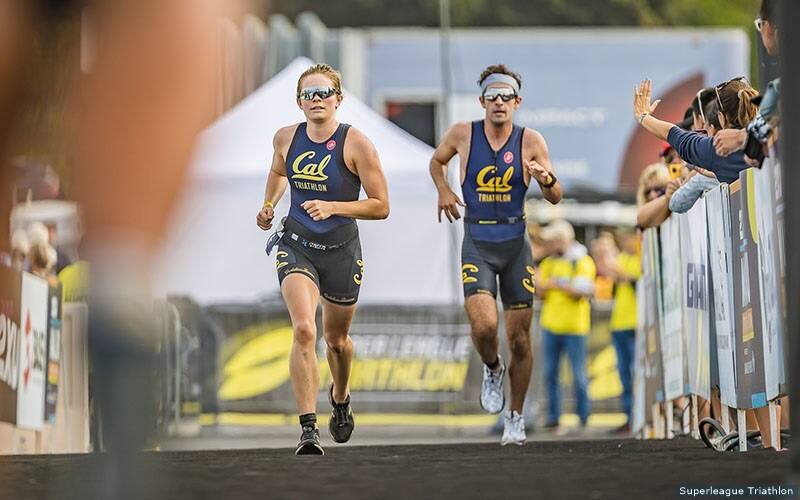 cal triathletes running down the finish line