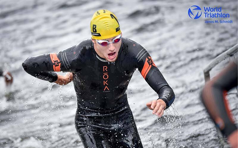 Chase McQueen exits the water in Hamburg Mixed Relay