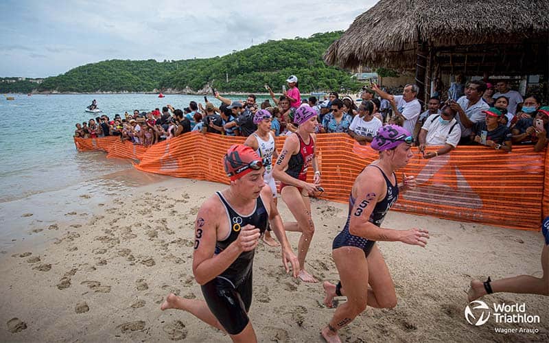 Female athletes exit the swim in Huatulco