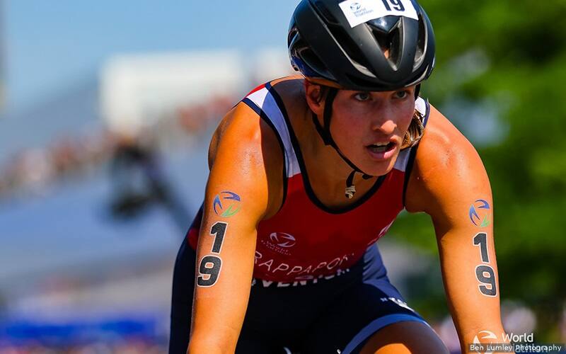 summer rappaport riding her bike wearing a red usa jersey