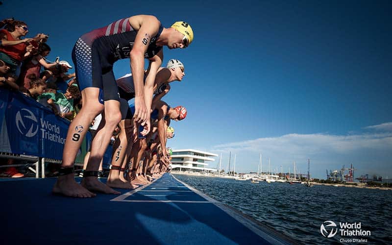 Matt McElroy stands not the swim pontoon at the World Cup Valencia