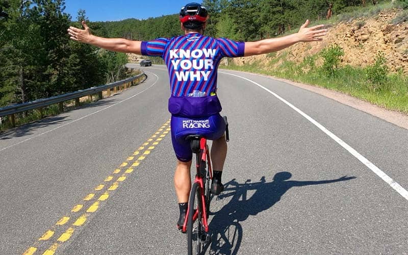 power within athlete riding on an open road