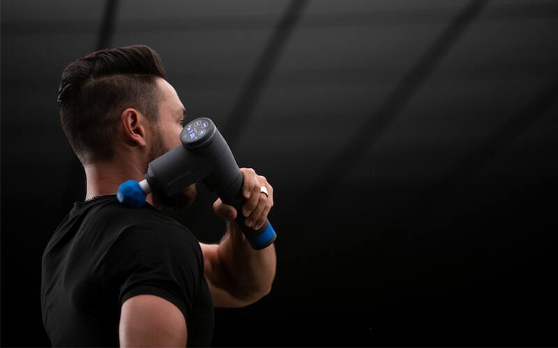 Man using BioZoom percussion gun