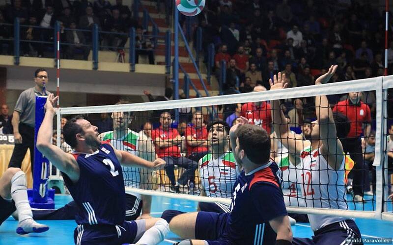 Dan Regan attacks against Iran during a men's sitting volleyball match